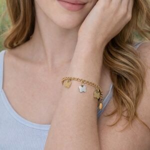 Gold and Silver Butterfly Charm Bracelet.